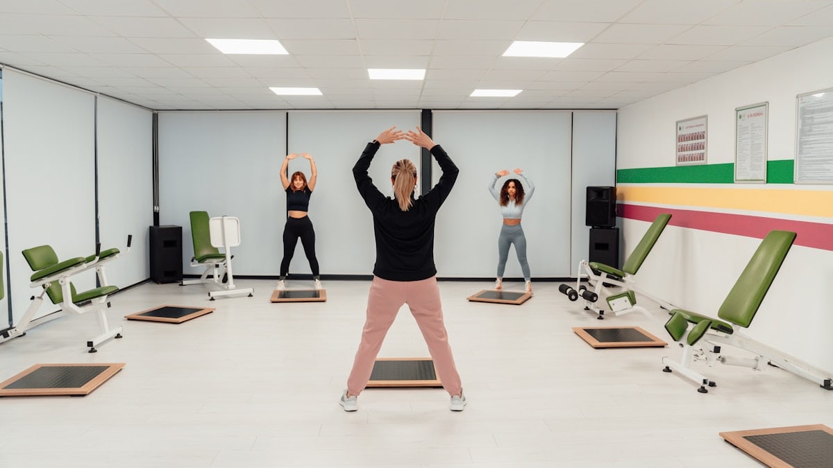a group of people doing exercises in a room
